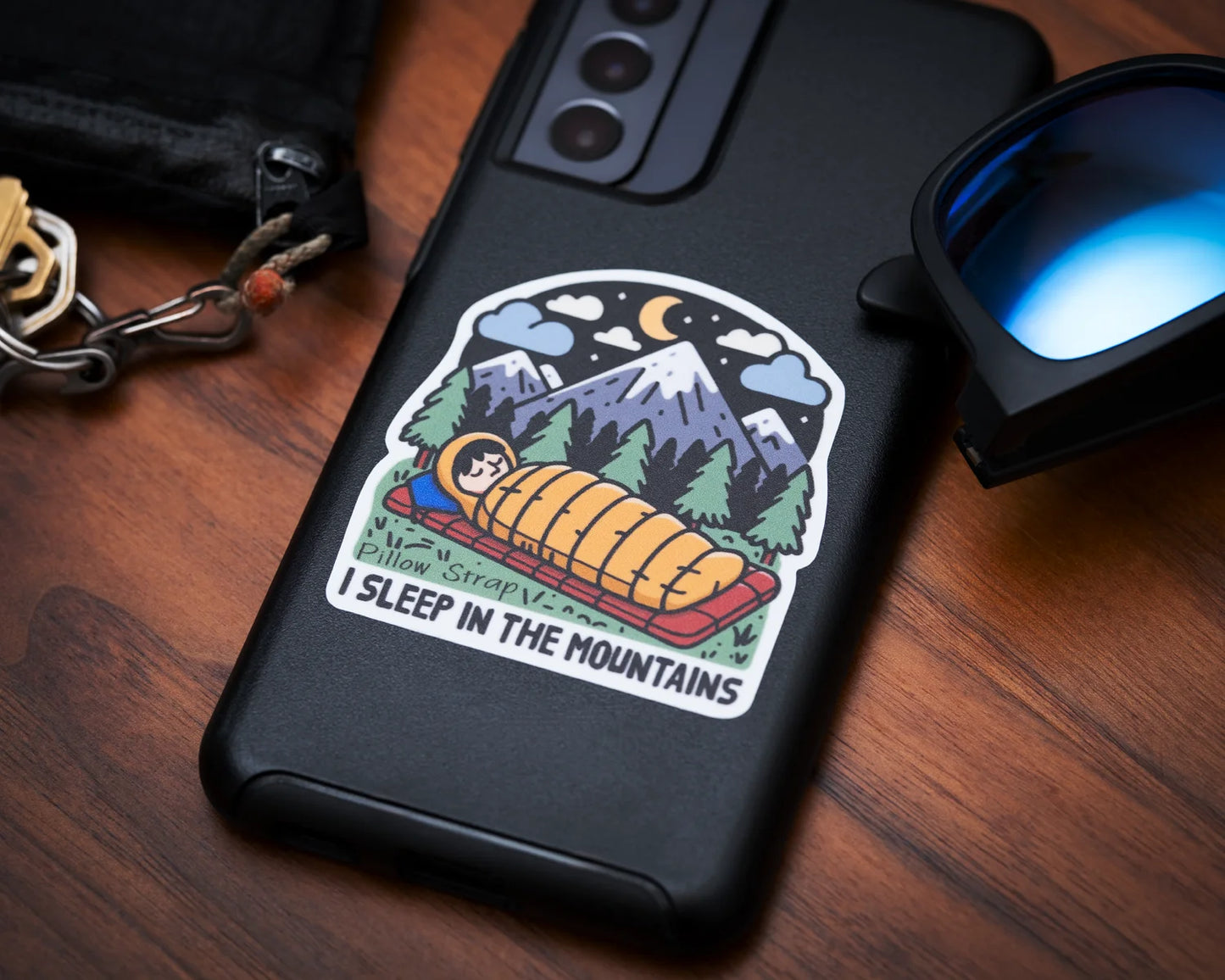 I Sleep In The Mountains Sticker on a cell phone case